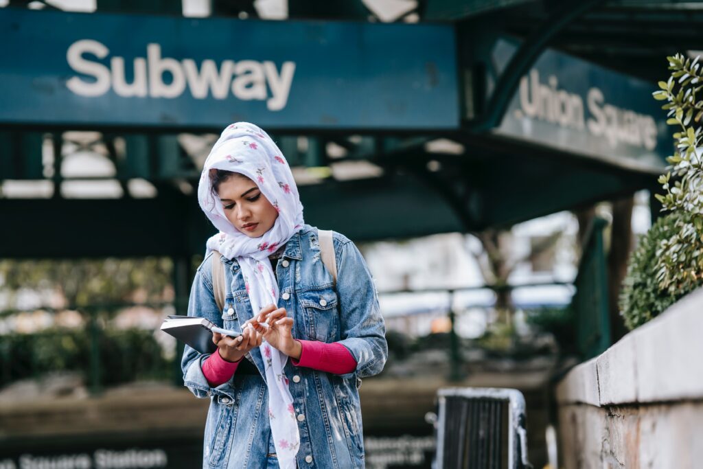 Student in front of subway